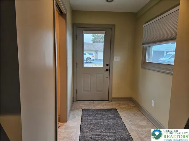 a kitchen with stainless steel appliances granite countertop a sink a stove and cabinets