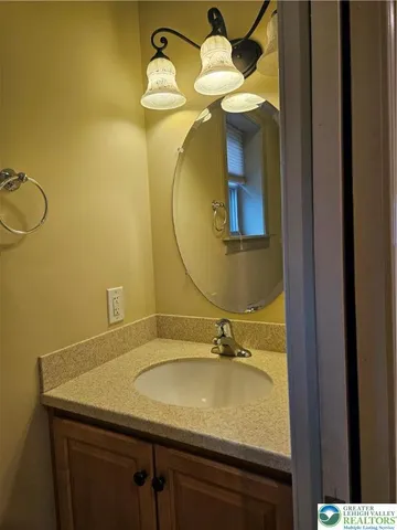 a view of a kitchen with stainless steel appliances granite countertop a refrigerator and a sink