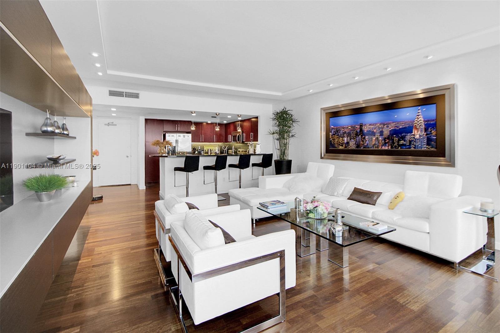 5600 Collins Avenue, Unit 9E Miami Beach, FL 33140 - Photo 15 of 55 a living room with furniture and a flat screen tv