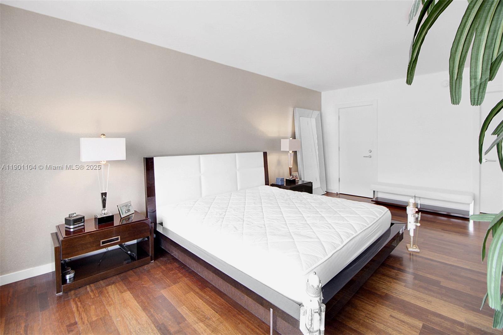 5600 Collins Avenue, Unit 9E Miami Beach, FL 33140 - Photo 20 of 55 a bed room with a bed and a chair