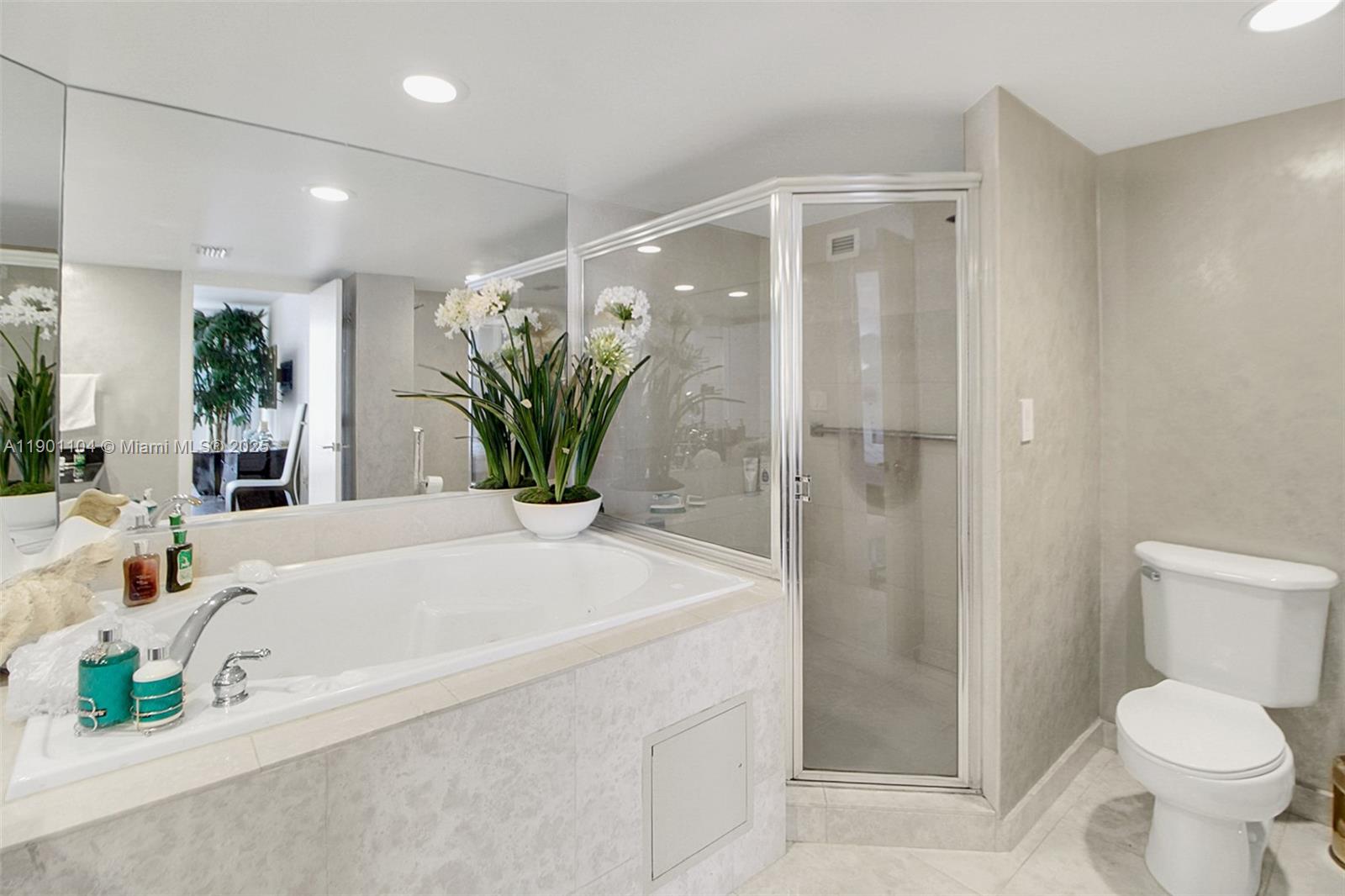 5600 Collins Avenue, Unit 9E Miami Beach, FL 33140 - Photo 23 of 55 a bathroom with a sink and toilet