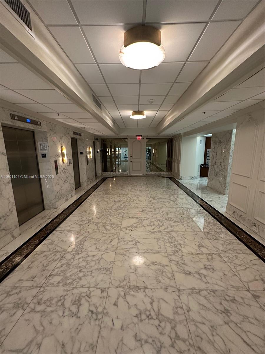5600 Collins Avenue, Unit 9E Miami Beach, FL 33140 - Photo 40 of 55 Elevator entrance 1st FL