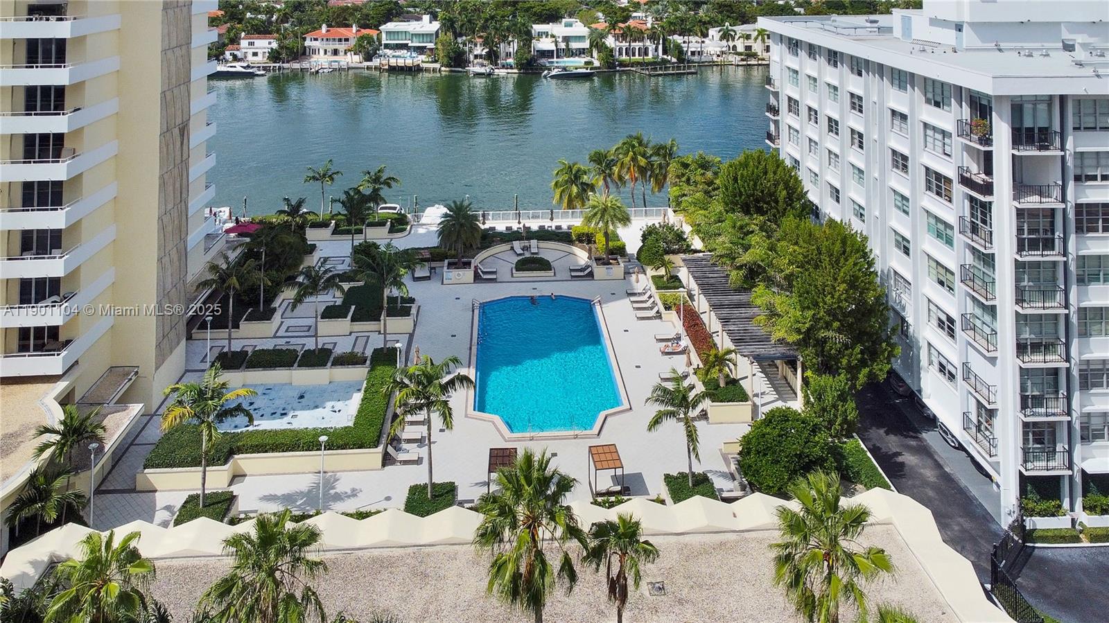 5600 Collins Avenue, Unit 9E Miami Beach, FL 33140 - Photo 4 of 55 an aerial view of residential houses with outdoor space and lake view