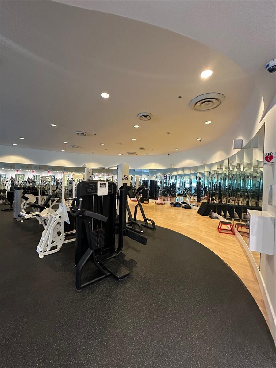5600 Collins Avenue, Unit 9E Miami Beach, FL 33140 - Photo 43 of 55 a view of a room with gym equipment