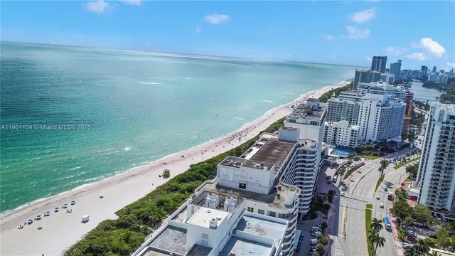 a kitchen with stainless steel appliances granite countertop a refrigerator a stove and a sink