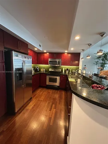 a kitchen with granite countertop counter top space and cabinets