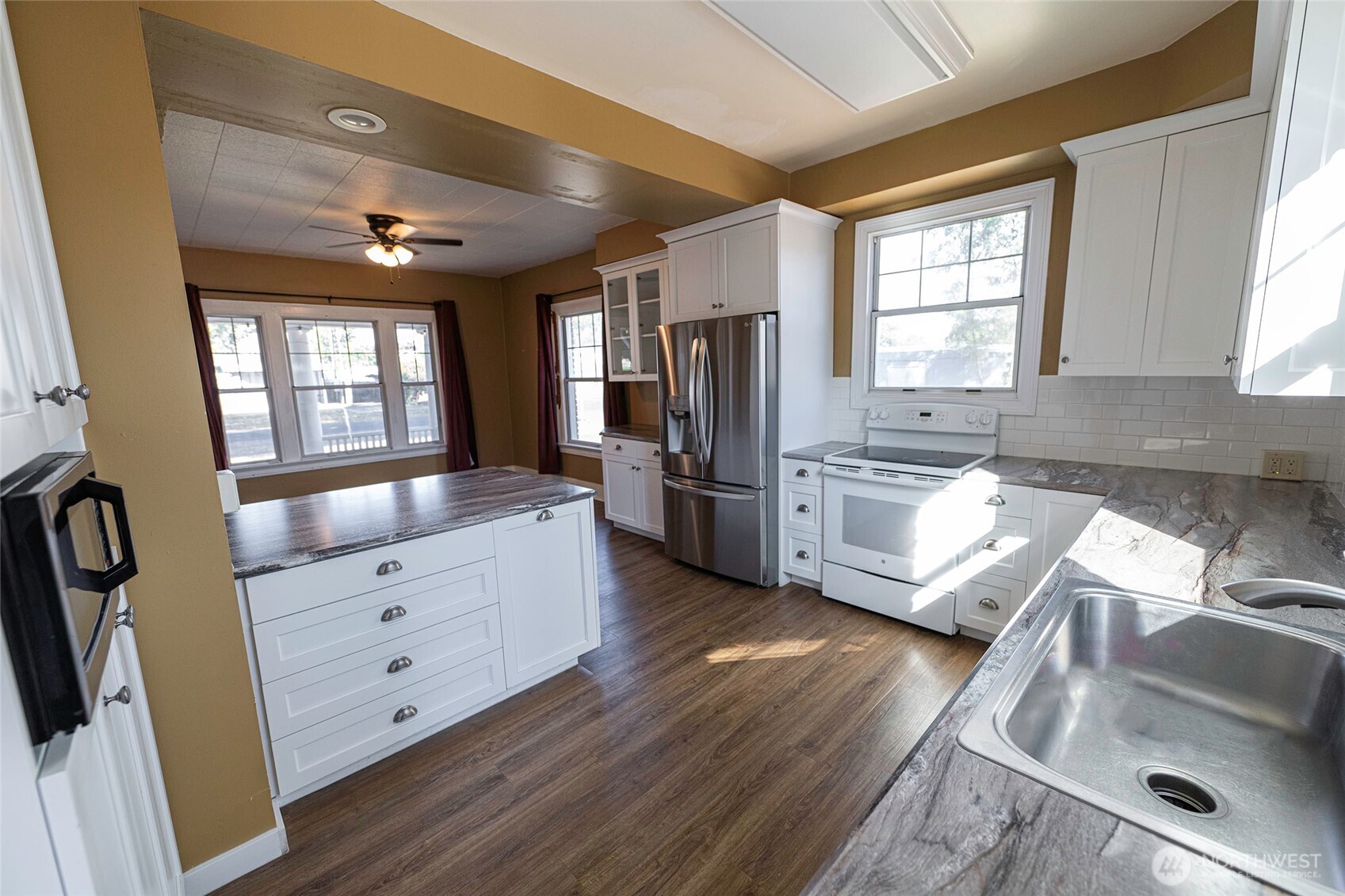 202 West 1st Street Prescott, WA 99348 - Photo 16 of 40 a kitchen with stainless steel appliances granite countertop a refrigerator and a sink