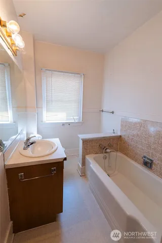 a bathroom with a sink and a bathtub