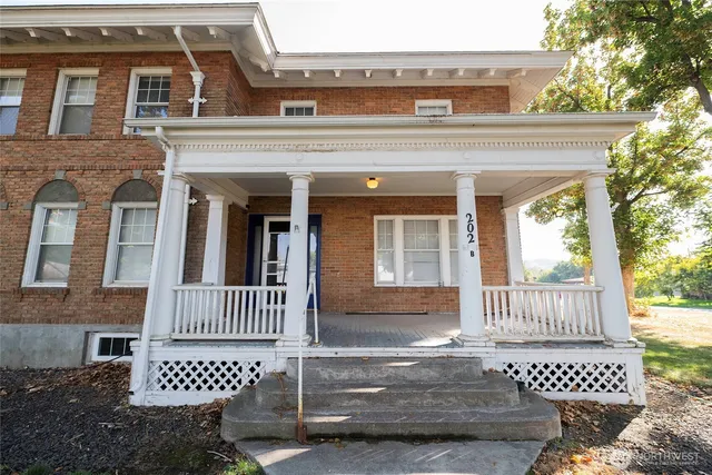 front view of a house with a bench