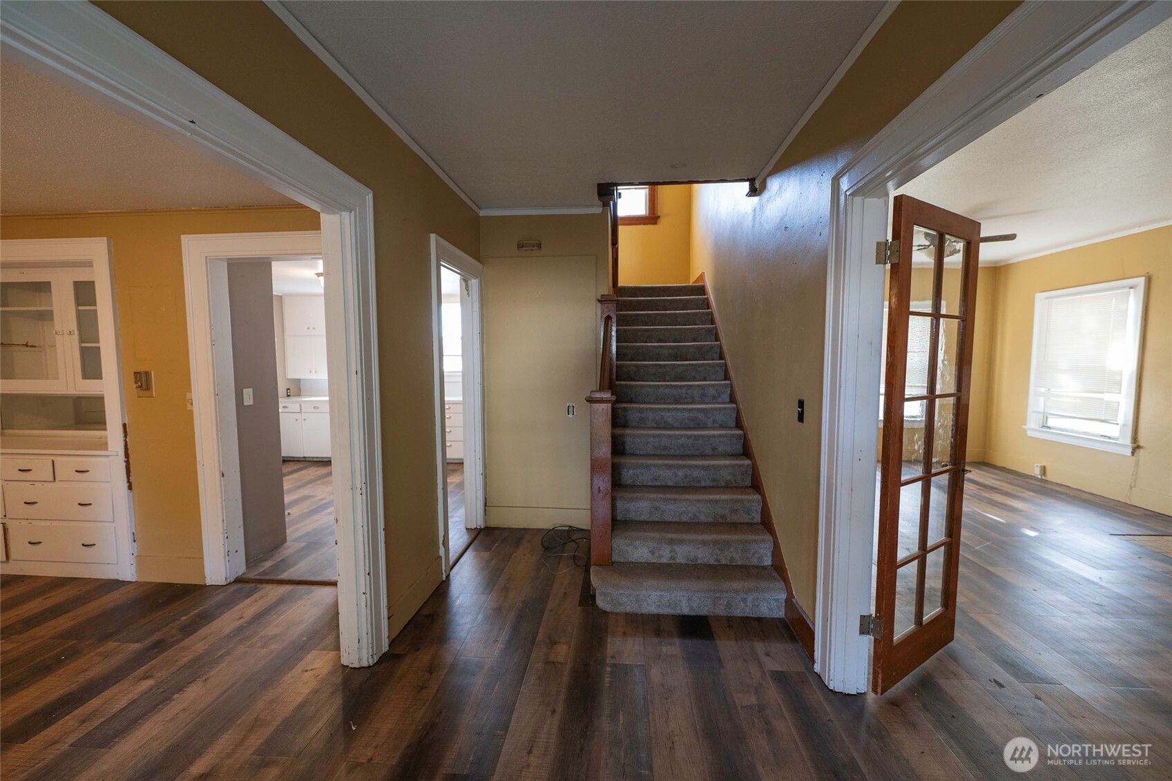 202 West 1st Street Prescott, WA 99348 - Photo 34 of 40 a view of a hallway with wooden floor and stairs