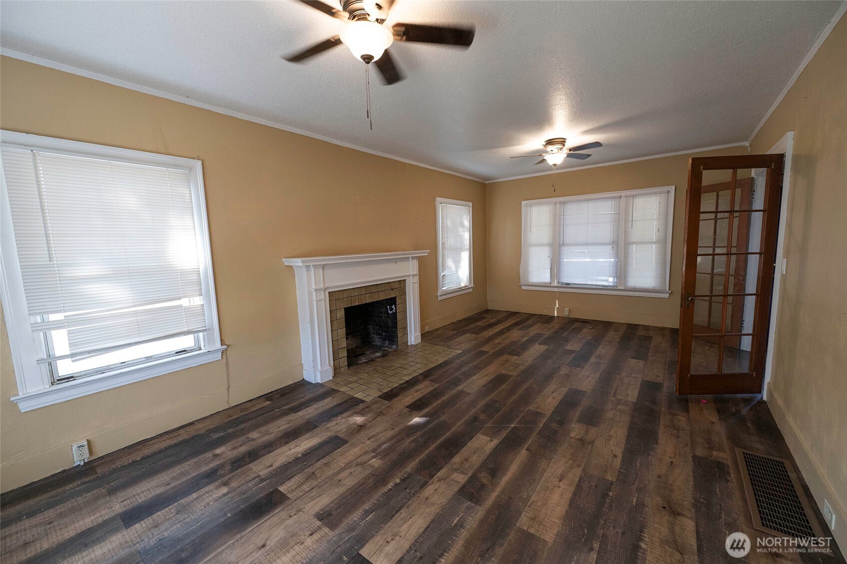 202 West 1st Street Prescott, WA 99348 - Photo 36 of 40 a view of empty room with wooden floor and fan