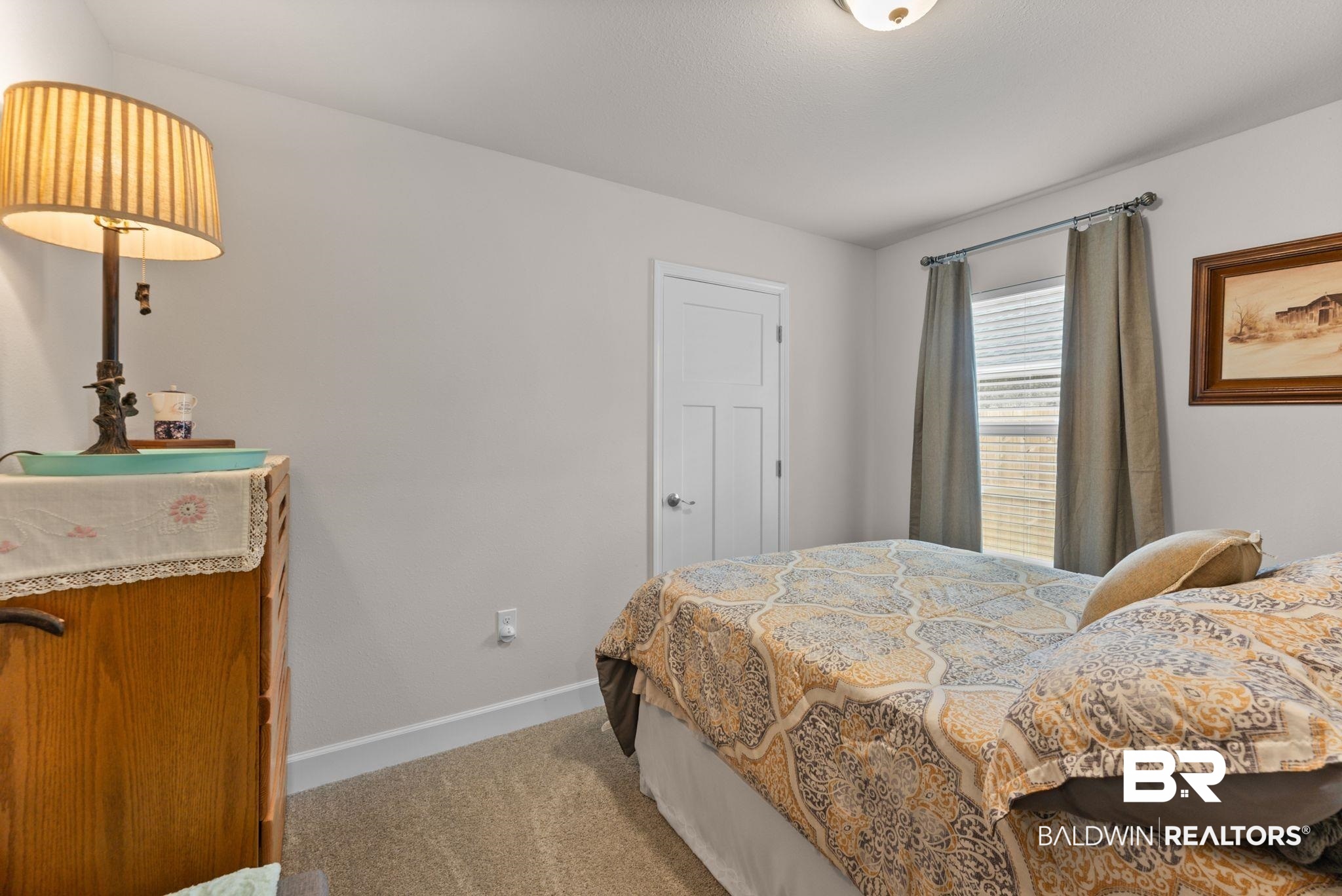 692 Mayflower Drive Foley, AL 36535 - Photo 23 of 40 Bedroom with baseboards and light colored carpet