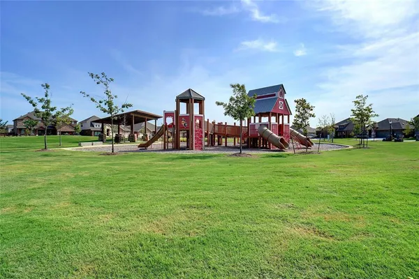 a view of a park with large trees