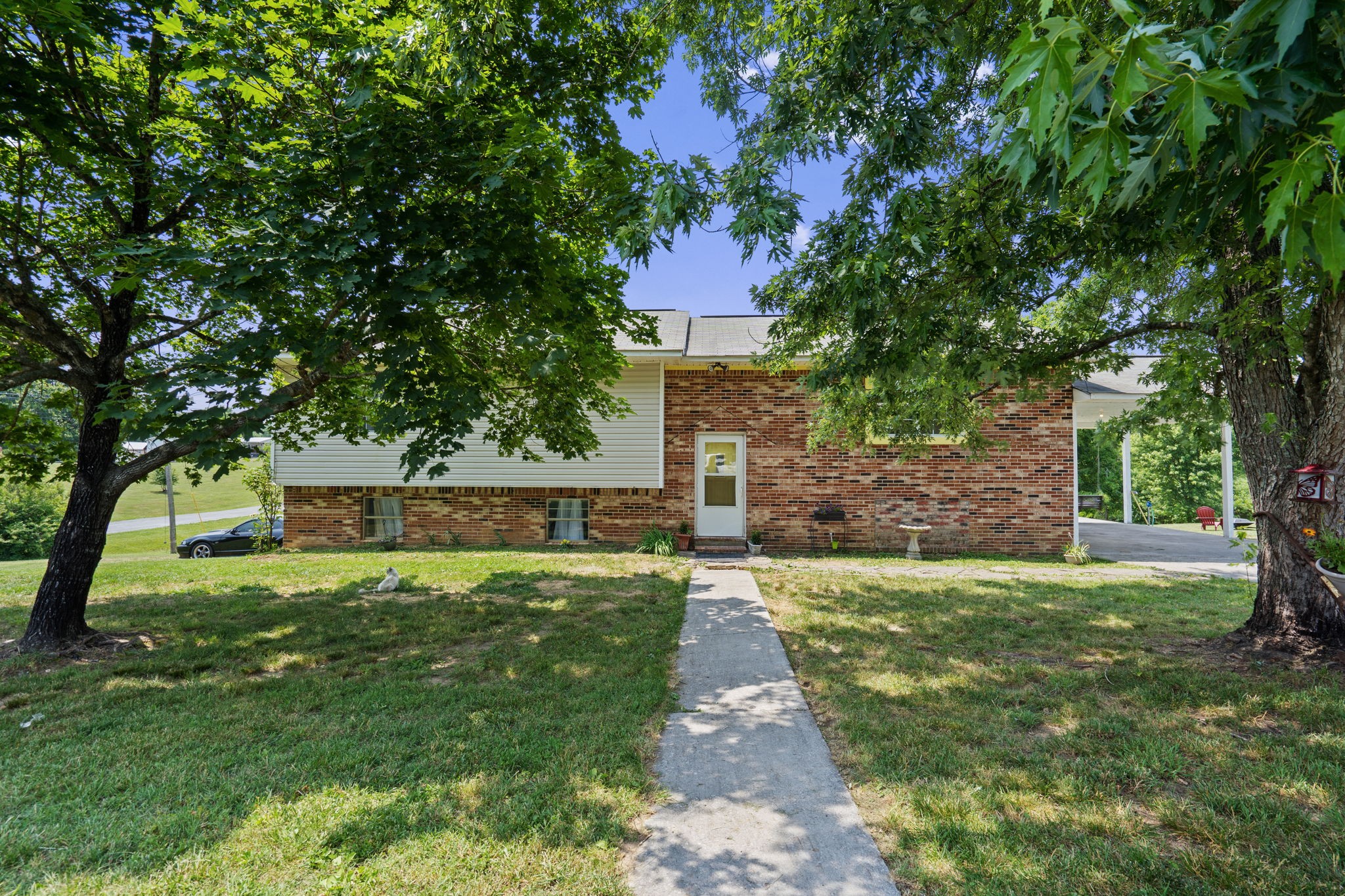 277 Harrison Road Spring City, TN 37381 - Photo 1 of 36 a view of a house with a yard