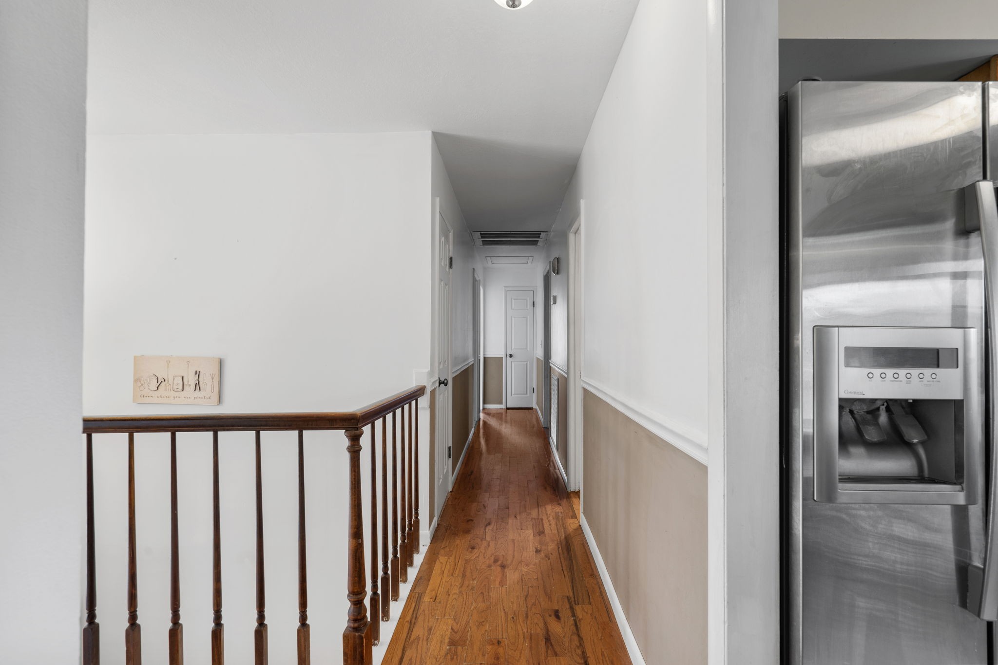 277 Harrison Road Spring City, TN 37381 - Photo 13 of 36 a view of a hallway with wooden floor and staircase