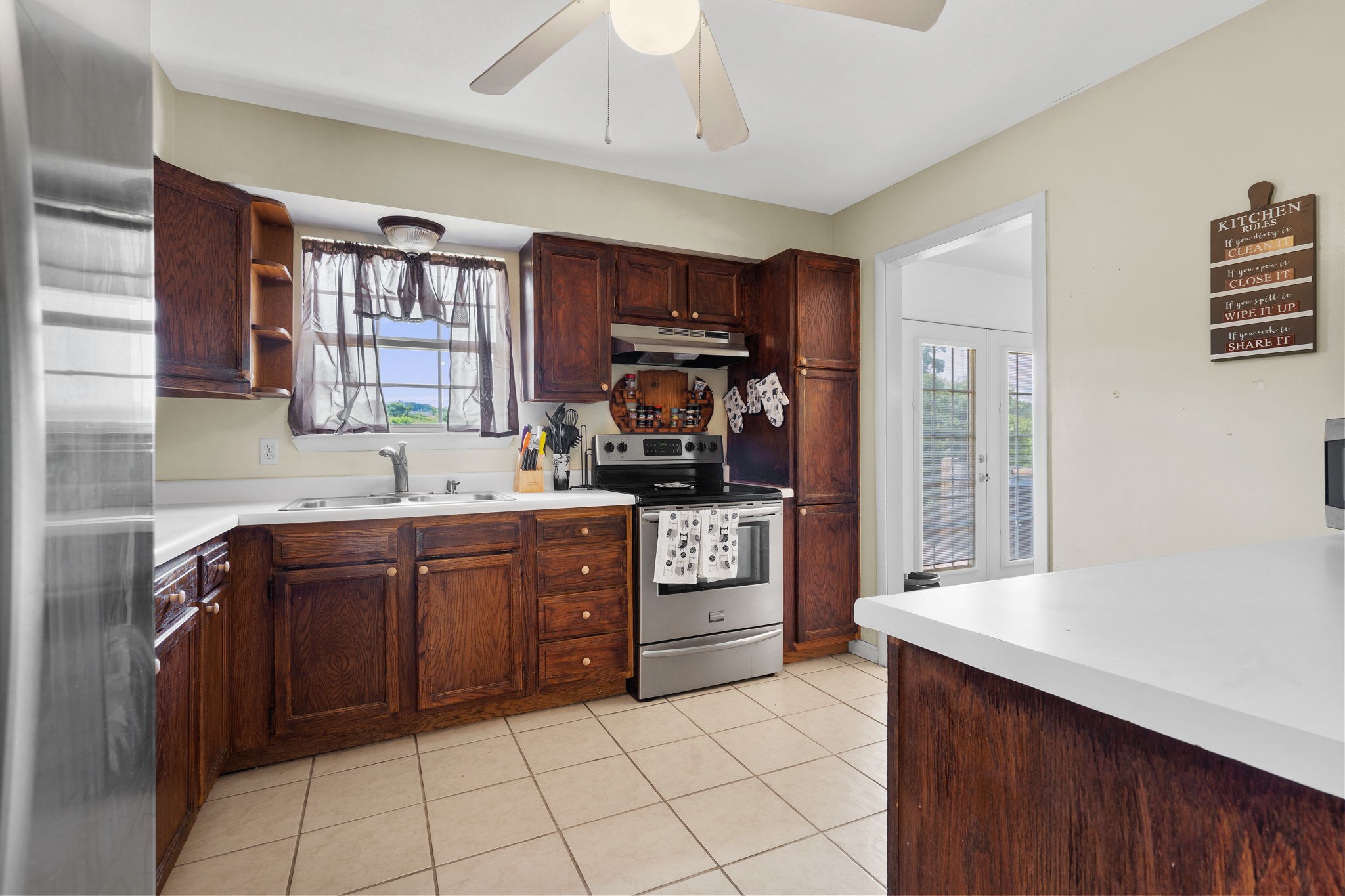 277 Harrison Road Spring City, TN 37381 - Photo 17 of 36 a kitchen with stainless steel appliances granite countertop a refrigerator and a stove top oven
