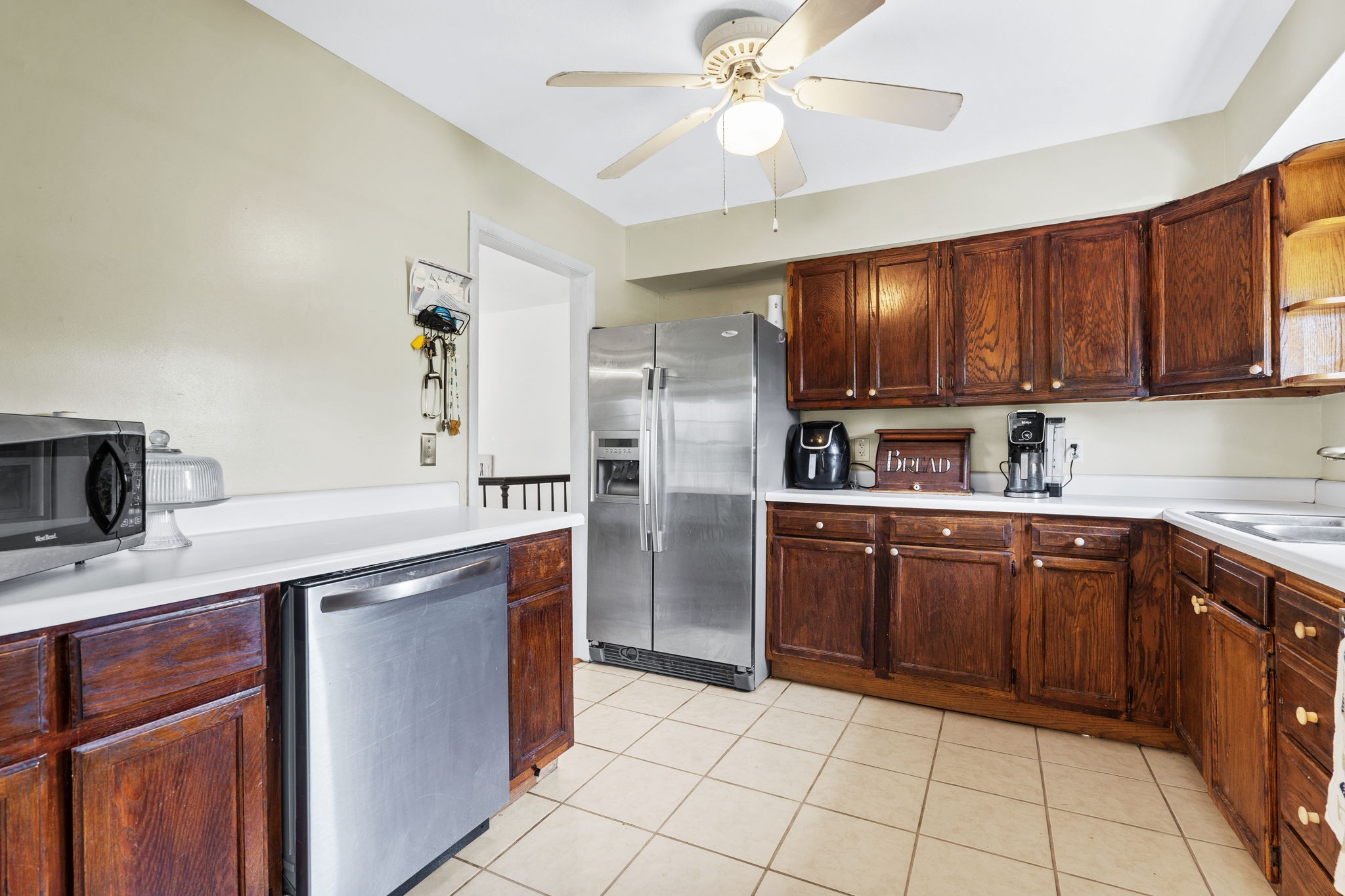 277 Harrison Road Spring City, TN 37381 - Photo 19 of 36 a kitchen with a cabinets a sink and appliances