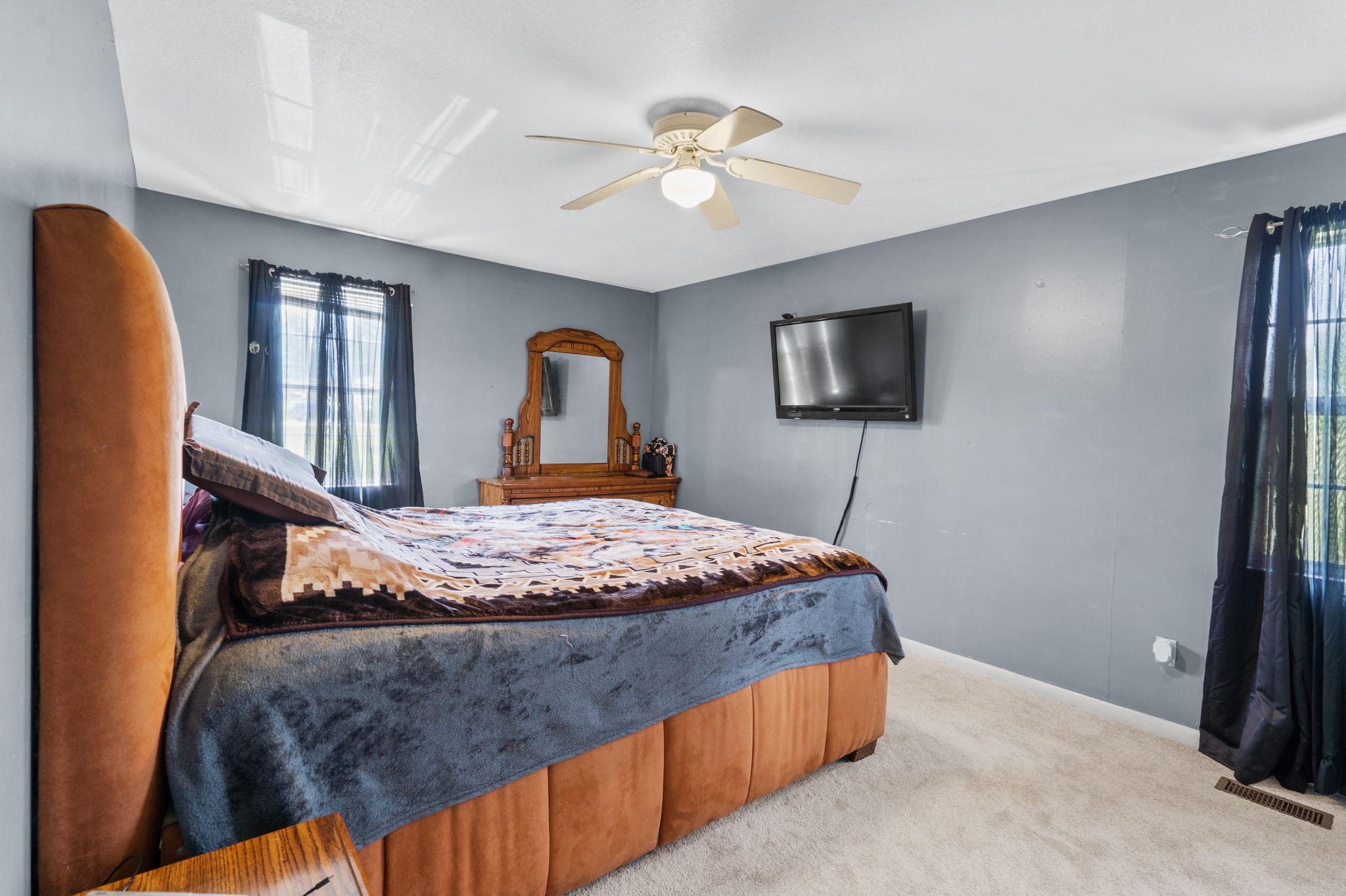 277 Harrison Road Spring City, TN 37381 - Photo 20 of 36 a bedroom with a bed window and a flat screen tv