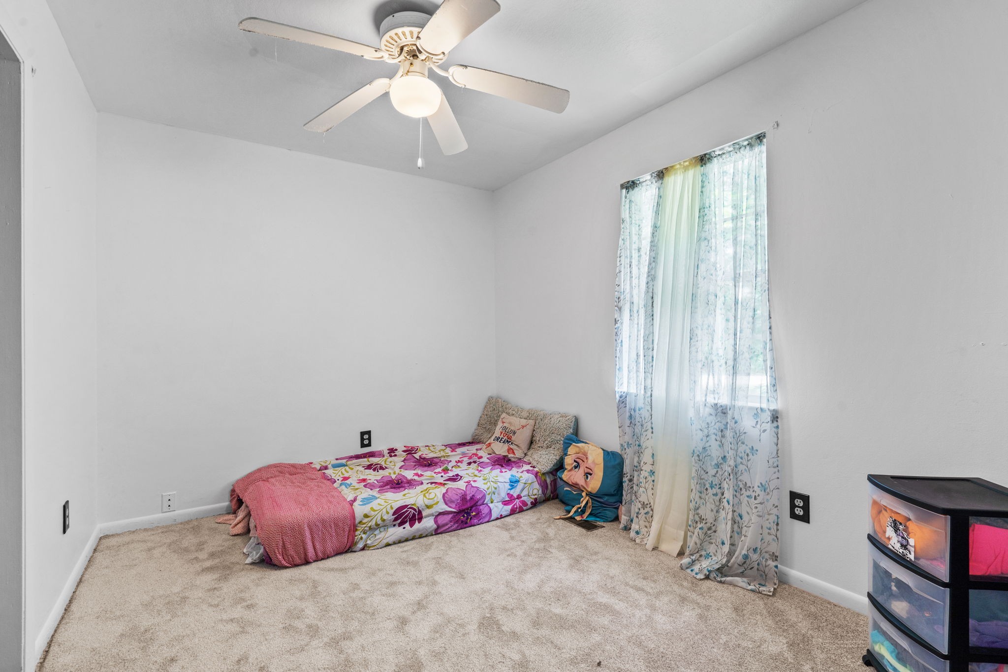 277 Harrison Road Spring City, TN 37381 - Photo 28 of 36 a bedroom with a bed and a chandelier fan