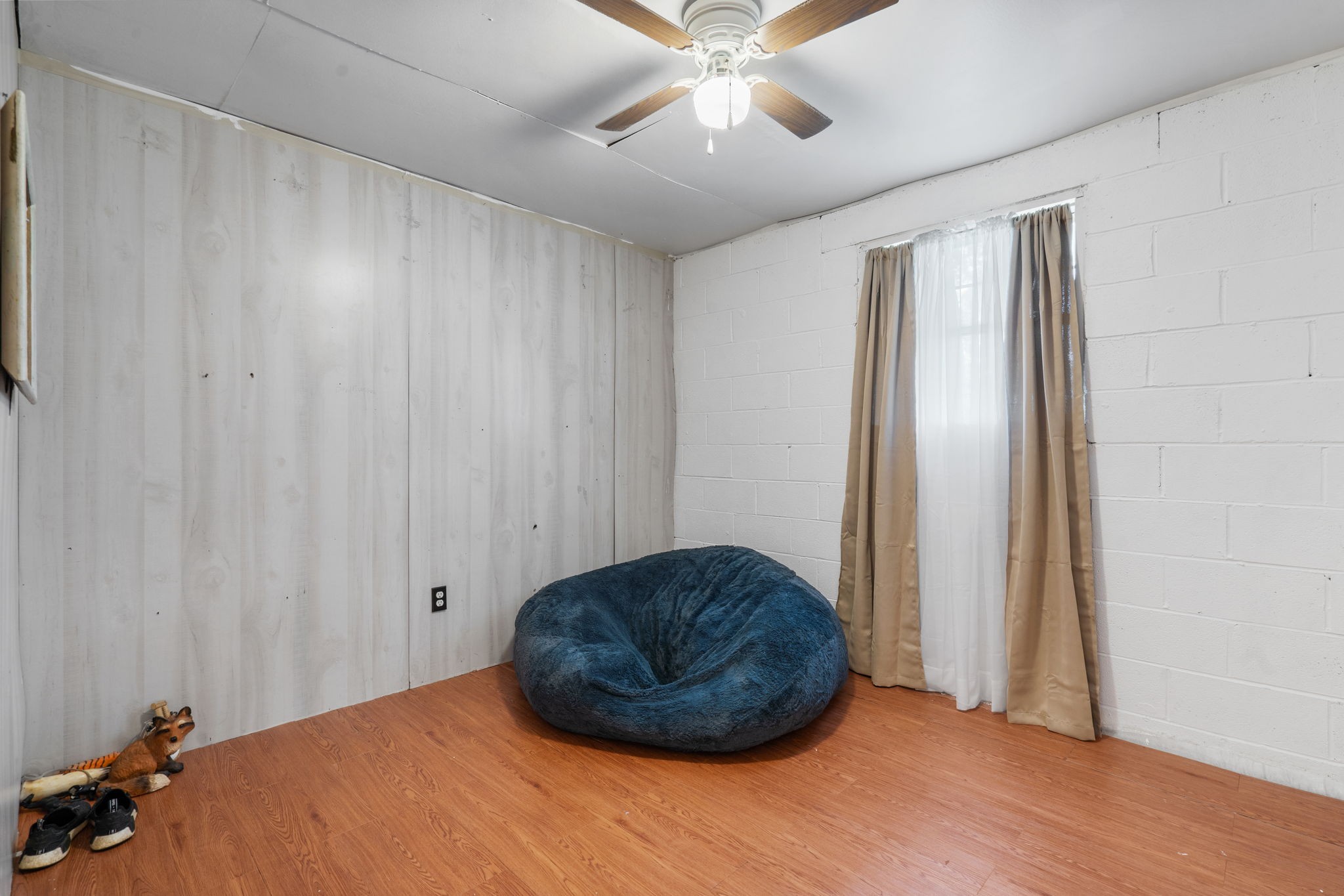 277 Harrison Road Spring City, TN 37381 - Photo 31 of 36 a bedroom with a bed and a chandelier