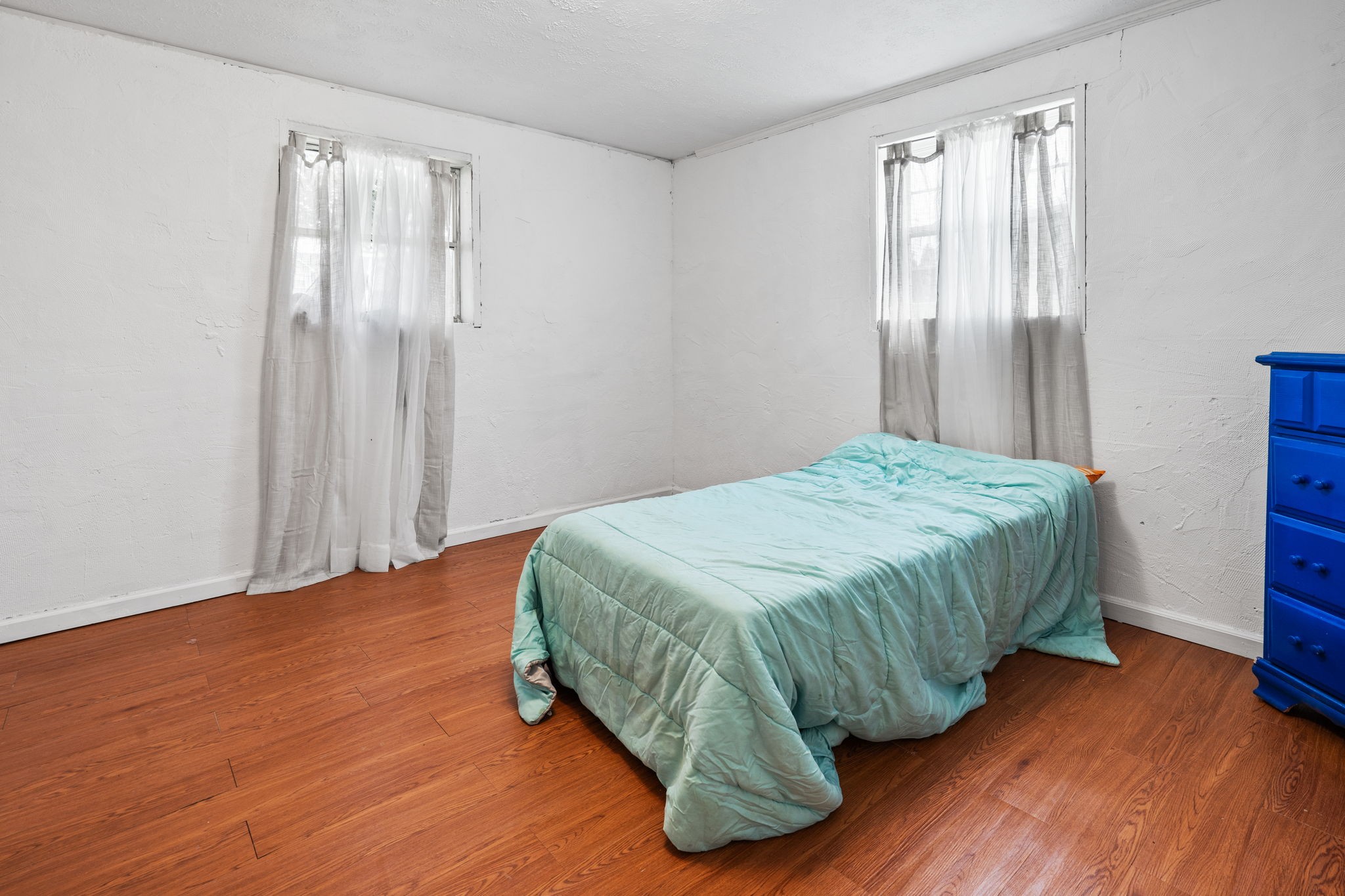 277 Harrison Road Spring City, TN 37381 - Photo 34 of 36 a bedroom with a bed and wooden floor