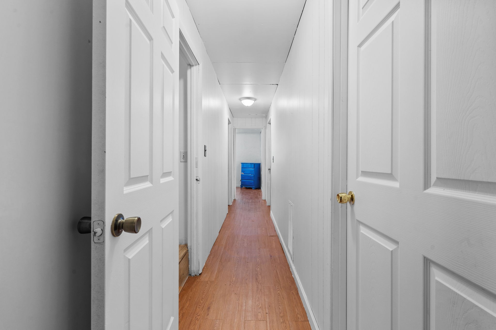 277 Harrison Road Spring City, TN 37381 - Photo 36 of 36 a view of a hallway with wooden floor and a glass door