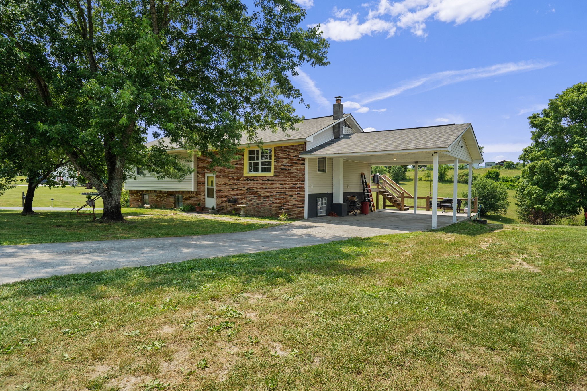 277 Harrison Road Spring City, TN 37381 - Photo 4 of 36 a front view of a house with a garden