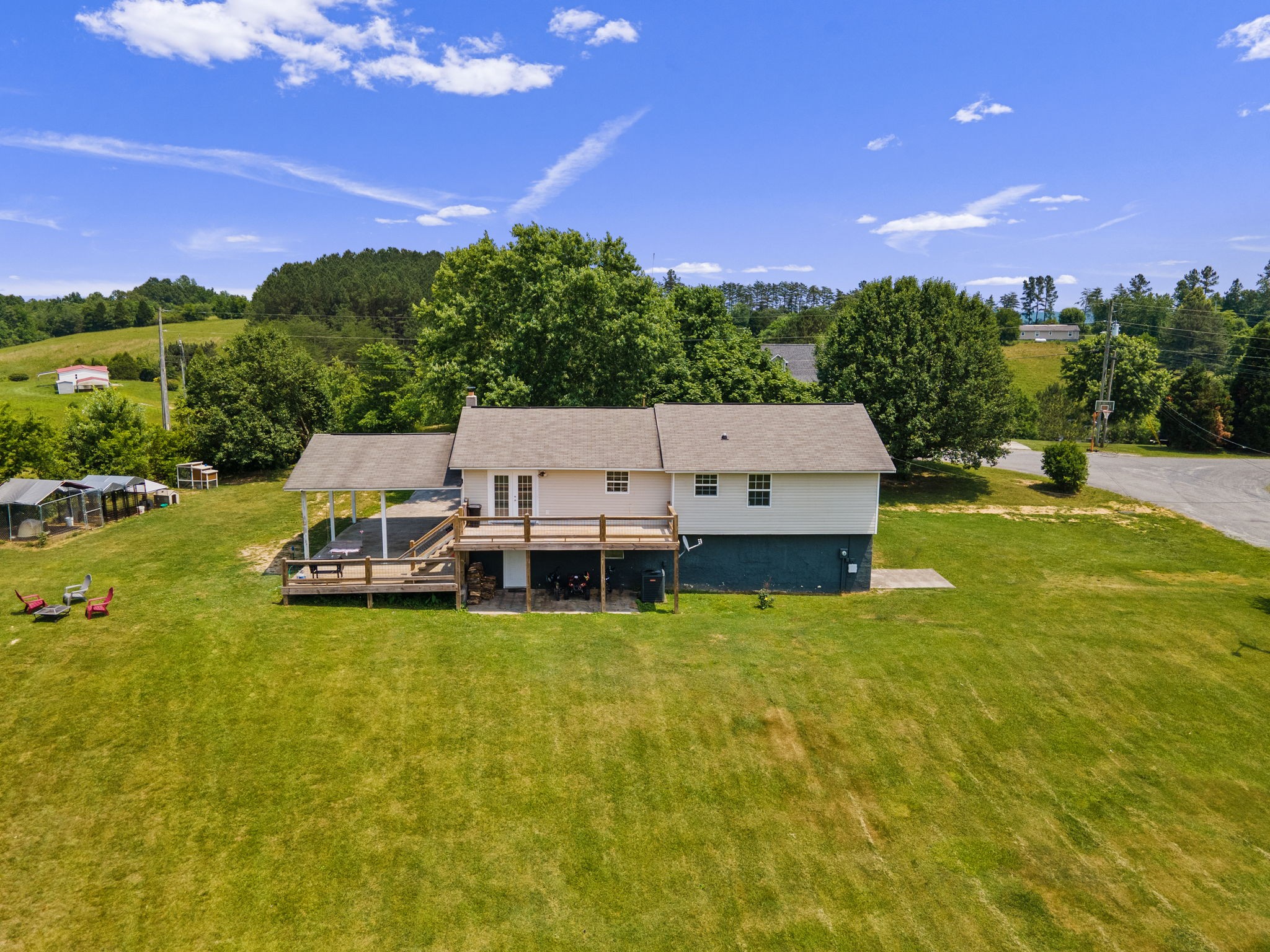 277 Harrison Road Spring City, TN 37381 - Photo 5 of 36 a view of a lake with houses