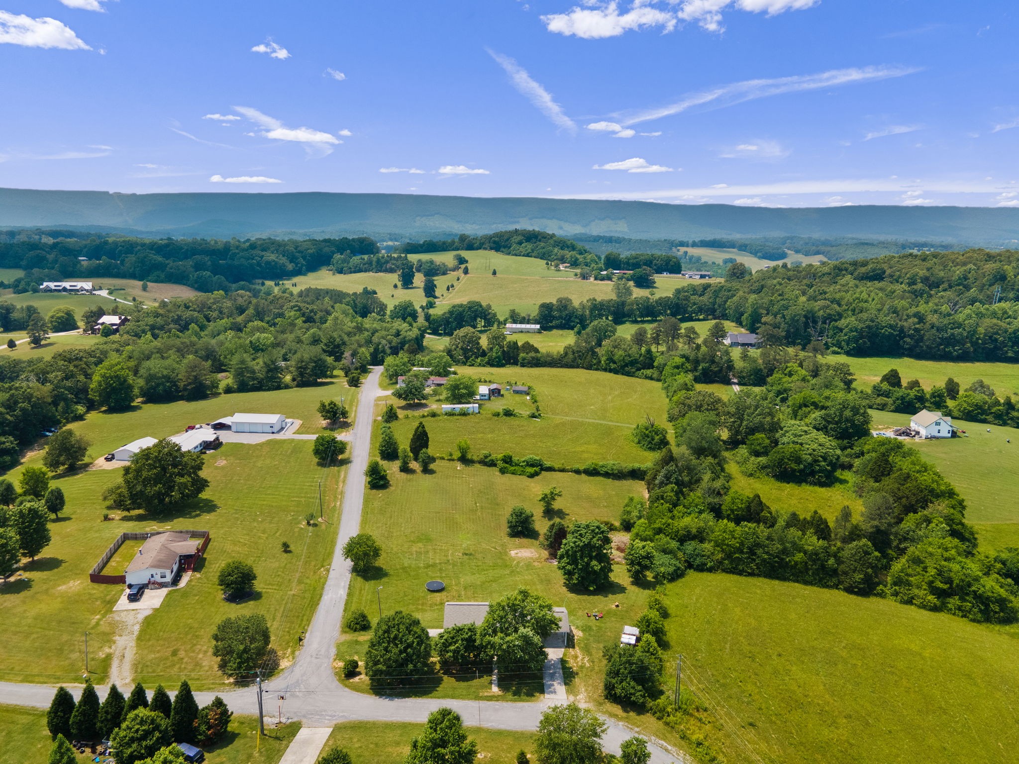 277 Harrison Road Spring City, TN 37381 - Photo 7 of 36 an aerial view of ocean with residential house swimming pool and outdoor space