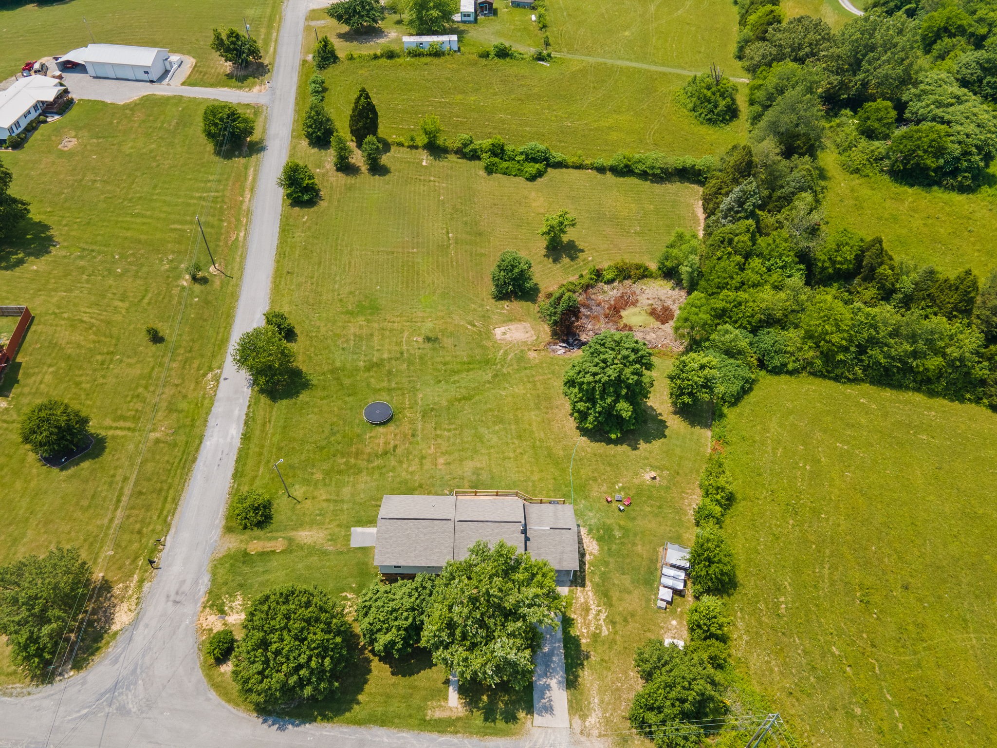 277 Harrison Road Spring City, TN 37381 - Photo 8 of 36 an aerial view of residential house with a yard