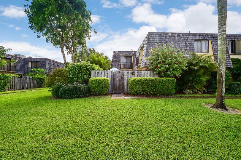 126 Woodland Road Palm Springs, FL 33461 - Photo 1 of 19 a view of a garden