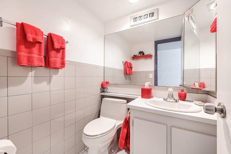 126 Woodland Road Palm Springs, FL 33461 - Photo 16 of 19 a bathroom with a sink vanity mirror and toilet