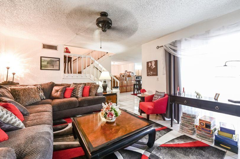 126 Woodland Road Palm Springs, FL 33461 - Photo 4 of 19 a living room with furniture and wooden floor