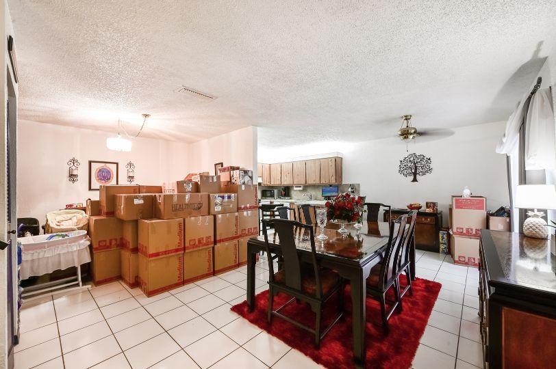 126 Woodland Road Palm Springs, FL 33461 - Photo 5 of 19 a living room with furniture