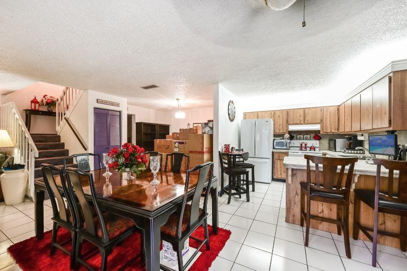 126 Woodland Road Palm Springs, FL 33461 - Photo 6 of 19 a view of a dining room with furniture