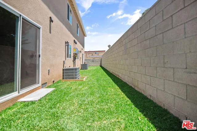 a view of a back yard of the house