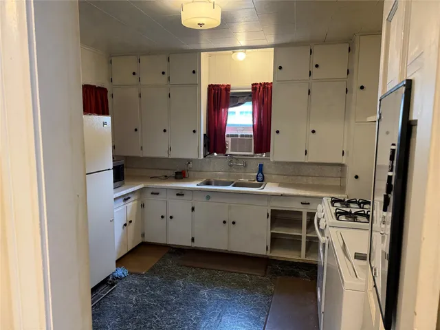 a view of a kitchen with cabinets