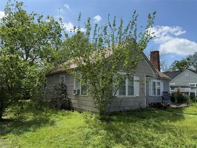 front view of a house with a garden