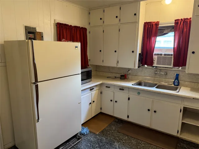 a utility room with cabinets