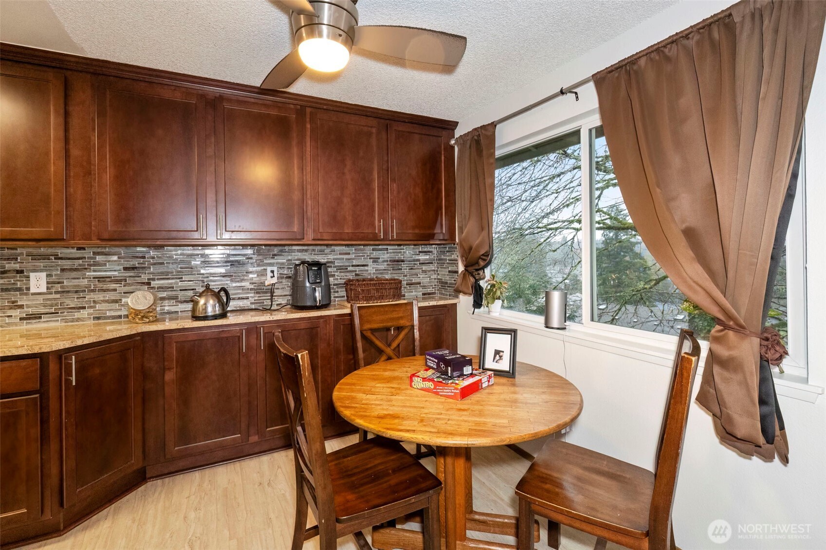 3400 Narrows View Lane Northeast, Unit 204 Bremerton, WA 98310 - Photo 11 of 38 a view of a dining room with furniture window and outside view