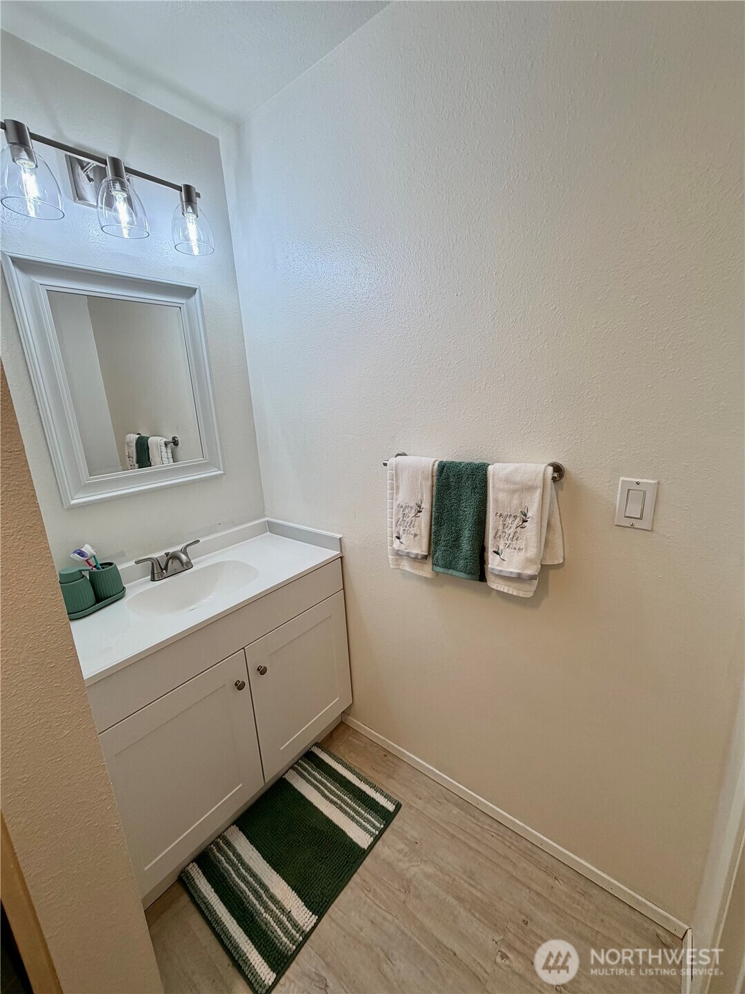 3400 Narrows View Lane Northeast, Unit 204 Bremerton, WA 98310 - Photo 25 of 38 a room with a sink and a mirror