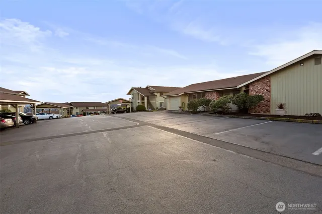 a view of street with parked cars
