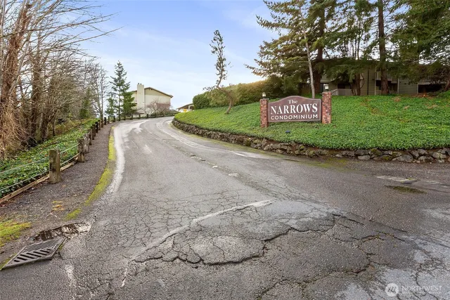 a sign board with a street view
