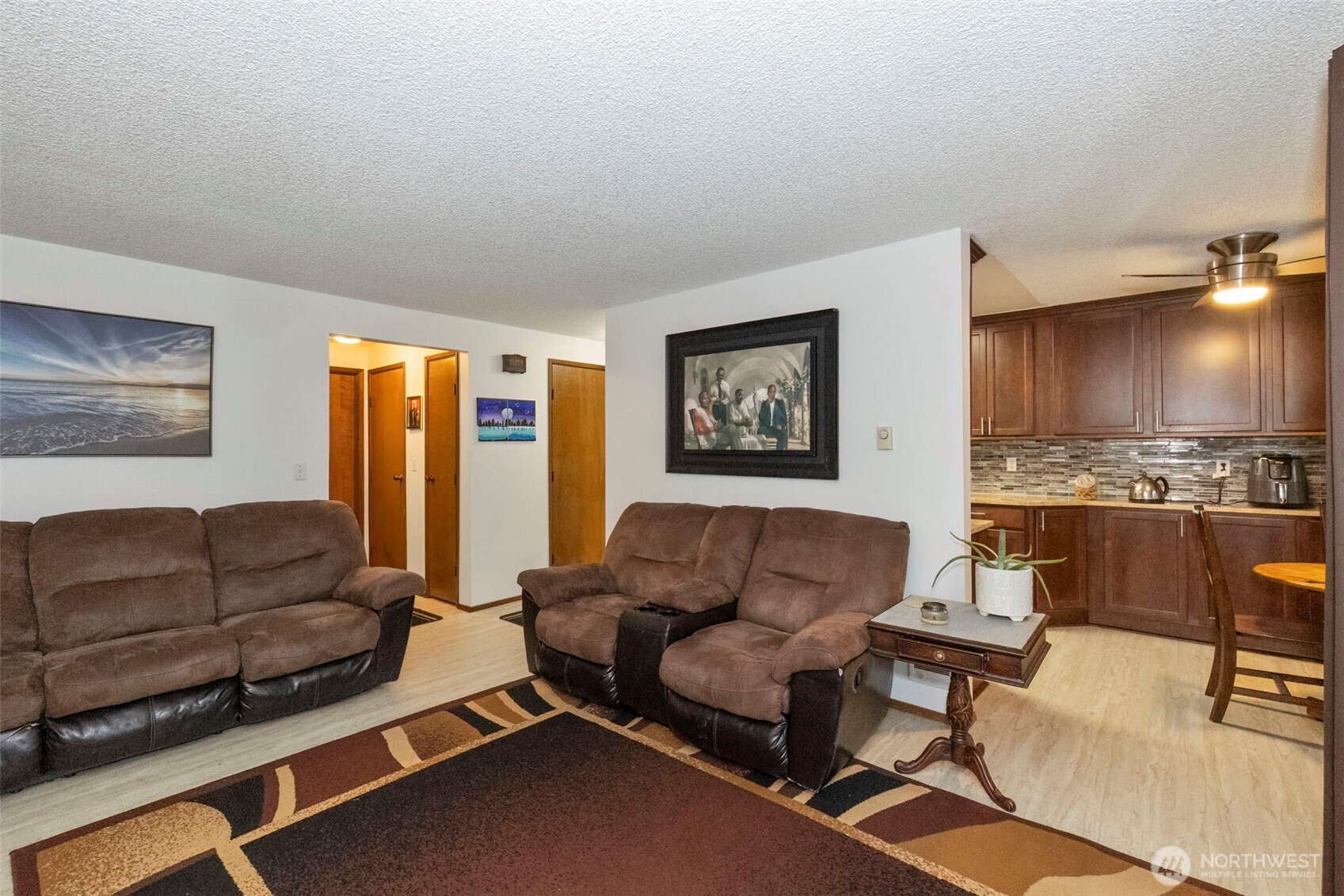 3400 Narrows View Lane Northeast, Unit 204 Bremerton, WA 98310 - Photo 10 of 38 a living room with furniture and a flat screen tv