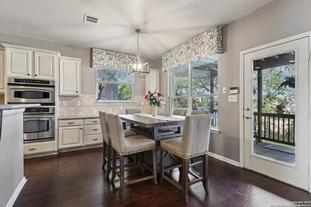 a kitchen with stainless steel appliances a refrigerator and stove