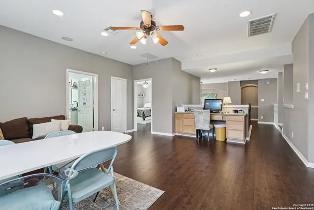 a large bathroom with a glass door shower and sink