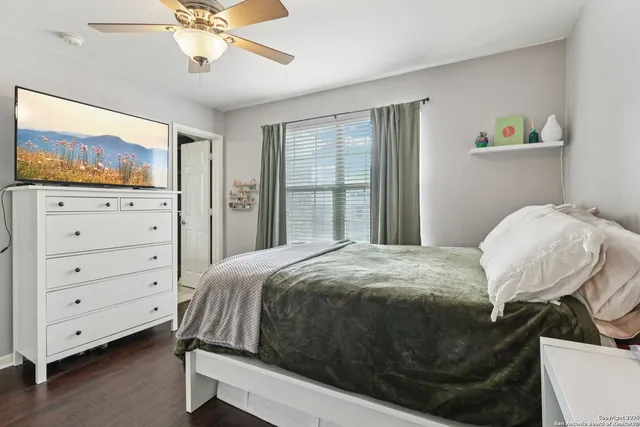 a view of a balcony with wooden floor and fence