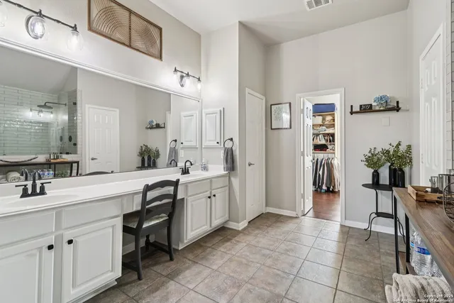 a view of a backyard with a tub and wooden fence