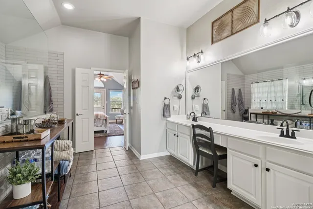 an aerial view of a houses with a yard