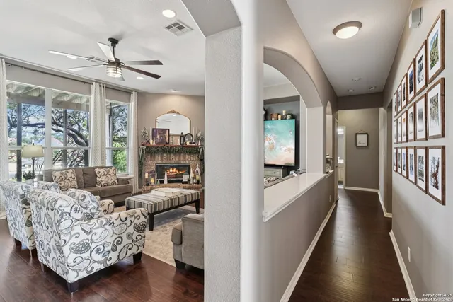 a view of a dining room with furniture and wooden floor